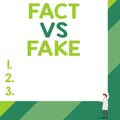 Handwriting text Fact Vs Fake. Concept meaning Rivalry or products or information originaly made or imitation Front view