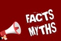 Handwriting text Facts Myths. Concept meaning work based on imagination rather than on real life difference Man holding megaphone Royalty Free Stock Photo