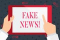 Handwriting text Fake News. Concept meaning false stories that appear to spread on internet using other media Hand Royalty Free Stock Photo