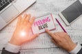 Handwriting text Feeling Blue. Concept meaning Feeling of desperation because of sadness or missing someone. Royalty Free Stock Photo