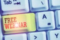 Handwriting text Free Webinar. Concept meaning Lecture Workshop Seminar that is transmitted over the Web White pc keyboard with Royalty Free Stock Photo