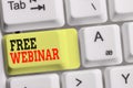 Handwriting text Free Webinar. Concept meaning Lecture Workshop Seminar that is transmitted over the Web White pc Royalty Free Stock Photo