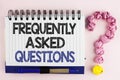 Handwriting text Frequently Asked Questions. Concept meaning most common inquiries Informations Help Guide written on Notebook Boo