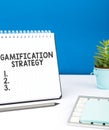 Handwriting text Gamification Strategy. Business idea use Rewards for Motivation Integrate Game Mechanics