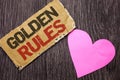 Handwriting text Golden Rules. Concept meaning Regulation Principles Core Purpose Plan Norm Policy Statement written on Cardboard Royalty Free Stock Photo