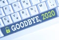 Handwriting text Goodbye 2020. Concept meaning New Year Eve Milestone Last Month Celebration Transition White pc Royalty Free Stock Photo