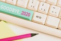 Handwriting text Goodbye 2020. Concept meaning New Year Eve Milestone Last Month Celebration Transition White pc Royalty Free Stock Photo