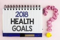 Handwriting text 2018 Health Golas. Concept meaning new year plan Workout healthy food Resolution goals written on Notebook Book o Royalty Free Stock Photo