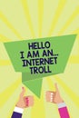 Handwriting text Hello I Am An ... Internet Troll. Concept meaning Social media troubles discussions arguments Man woman hands thu Royalty Free Stock Photo