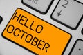 Handwriting text Hello October. Concept meaning Last Quarter Tenth Month 30days Season Greeting Keyboard orange key Royalty Free Stock Photo