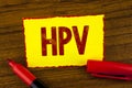 Handwriting text Hpv. Concept meaning Human Papillomavirus Infection Sexually Transmitted Disease Illness written on Yellow Sticky