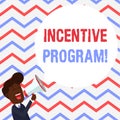 Handwriting text Incentive Program. Concept meaning specific scheme used to promote certain action or behavior Young Man Royalty Free Stock Photo