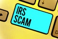 Handwriting text Irs Scam. Concept meaning targeted taxpayers by pretending to be Internal Revenue Service Keyboard blue key Inten Royalty Free Stock Photo