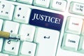 Handwriting text Justice. Concept meaning impartial adjustment of conflicting claims or assignments White pc keyboard Royalty Free Stock Photo