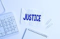 Handwriting text Justice. Concept meaning Quality of being just impartial or fair Administration of law rules White pc keyboard Royalty Free Stock Photo