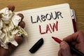 Handwriting text Labour Law. Concept meaning Employment Rules Worker Rights Obligations Legislation Union written by Man on Notebo