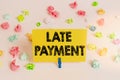 Handwriting text Late Payment. Concept meaning payment made to the lender after the due date has passed Colored crumpled papers