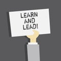 Handwriting text Learn And Lead. Concept meaning Improve the skills and knowledge to fit for the leadership. Royalty Free Stock Photo