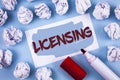 Handwriting text Licensing. Concept meaning Grant a license Legally permit the use of something Allow activity written on Painted Royalty Free Stock Photo