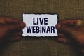 Handwriting text Live Webinar. Concept meaning Interactive seminar transmitted over the web Real Time Man holding piece paper blac Royalty Free Stock Photo