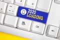 Handwriting text 2020 Loading. Concept meaning Advertising the upcoming year Forecasting the future event White pc Royalty Free Stock Photo