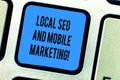 Handwriting text Local Seo And Mobile Marketing. Concept meaning Search engine optimization Digital promotion Keyboard