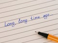 Handwriting text Long, Long Time Ago... on lined paper with pen Royalty Free Stock Photo
