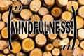 Handwriting text Mindfulness. Concept meaning Being Conscious Awareness Calm Accept thoughts and feelings Wooden background