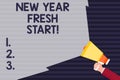 Handwriting text New Year Fresh Start. Concept meaning Time to follow resolutions reach out dream job Hand Holding