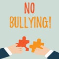 Handwriting text No Bullying. Concept meaning stop aggressive behavior among children power imbalance Two Hands Holding