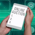 Handwriting text Online Auction. Business idea digitized sale event which item is sold to the highest bidder