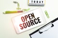 Handwriting text Open Source. Business idea denoting software which original source code freely available Royalty Free Stock Photo