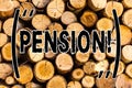 Handwriting text Pension. Concept meaning Income seniors earn after retirement Saves for elderly years Wooden background vintage