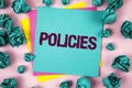 Handwriting text Policies. Concept meaning Business Company or Government Rules Regulations Standards written on Sticky Note Paper