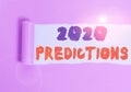 Handwriting text 2020 Predictions. Concept meaning statement about what you think will happen in 2020 Cardboard which is