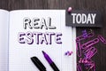 Handwriting text Real Estate. Concept meaning Residential Property Building Covered Land Chattels Real written on Notebook Book on Royalty Free Stock Photo