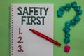 Handwriting text Safety First. Concept meaning Avoid any unnecessary risk Live Safely Be Careful Pay attention Notebook marker cru