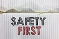 Handwriting text Safety First. Concept meaning Avoid any unnecessary risk Live Safely Be Careful Pay attention Open notebook page