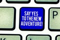 Handwriting text Say Yes To The New Adventure. Concept meaning Exploring the world traveling life experience Keyboard Royalty Free Stock Photo