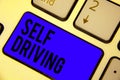 Handwriting text Self Driving. Concept meaning Autonomous vehicle Ability to navigate without human input Keyboard blue key Intent
