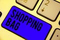 Handwriting text Shopping Bag. Concept meaning Containers for carrying personal possessions or purchases Keyboard blue key Intenti Royalty Free Stock Photo