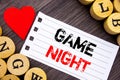 Handwriting text showing Game Night. Conceptual photo Entertainment Fun Play Time Event For Gaming written on tear note paper stic Royalty Free Stock Photo
