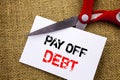 Handwriting text showing Pay Off Debt. Conceptual photo Reminder To Paying Owed Financial Credit Loan Bills written on Sticky Note