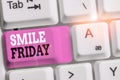 Handwriting text Smile Friday. Concept meaning used to express happiness from beginning of fresh week White pc keyboard