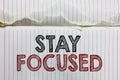 Handwriting text Stay Focused. Concept meaning Be attentive Concentrate Prioritize the task Avoid distractions Open notebook page Royalty Free Stock Photo
