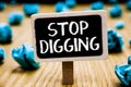 Handwriting text Stop Digging. Concept meaning Prevent Illegal excavation quarry Environment Conservation Blackboard crumpled pape Royalty Free Stock Photo