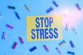 Handwriting text Stop Stress. Concept meaning Seek help Take medicines Spend time with loveones Get more sleep Colored clothespin