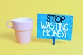 Handwriting text Stop Wasting Money. Concept meaning advicing demonstrating or group to start saving and use it wisely Royalty Free Stock Photo