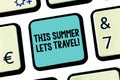 Handwriting text This Summer Lets Travel. Concept meaning Invitation to trip on vacations sunny season of year Keyboard
