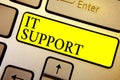 Handwriting text It Support. Concept meaning Lending help about information technologies and relative issues Keyboard yellow key I Royalty Free Stock Photo